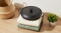 I Used A Pot Lid Organizer To Store My Blankets, And It’s Brilliant