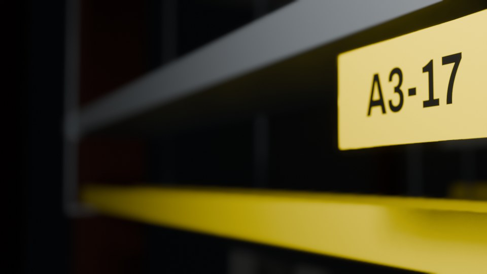 Close-up of a yellow cable tray label reading A3-17 above a cable tray in a dark fictional data hall